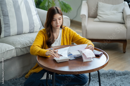 stressed woman trying money to pay credit card debt and worry by calculate expense from invoice or electricity bill,water bill not able money to pay mortgage.debt,loan,bankruptcy,Bad financial concept photo