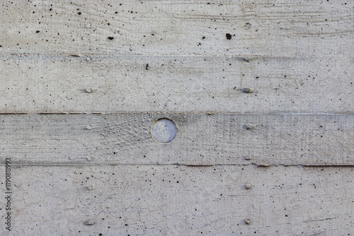 Detail of a concrete wall with some wood texture in it.