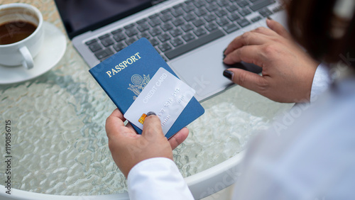 Obraz na płótnie Female hand holding passport and credit card, booking tickets for vacation travel planning, hotel booking, accommodation, finance, shopping lifestyle for convenience. w salonie