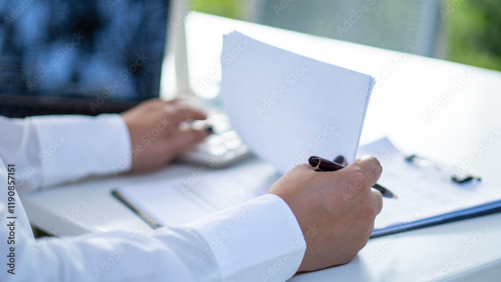 businesswoman check company finances and earnings and budget. Business woman calculating expenses, managing budget, papers, loan documents, invoices. count taxes rental tenancy sum to pay online.