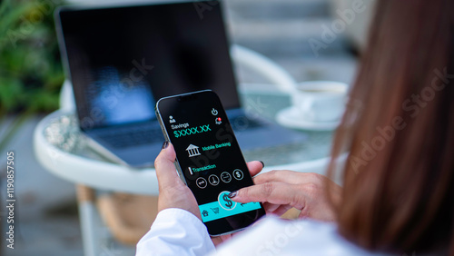 Obraz na płótnie online shopping and payment via mobile banking apps. a woman accessing a mobile banking app on her smartphone, Internet bank, money transaction, fintech, Digital banking network, internet payment w salonie