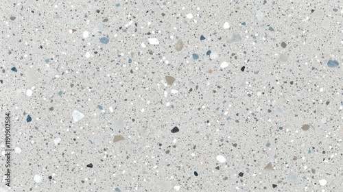 Elegant terrazzo surface showcasing delicate speckles in gray, white, and soft blue against a smooth gray backdrop