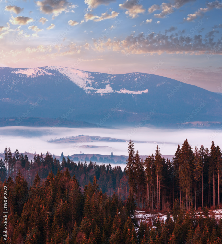 Early spring Carpathian mountains plateau landscape with snow-covered ridge tops in far, Ukraine.