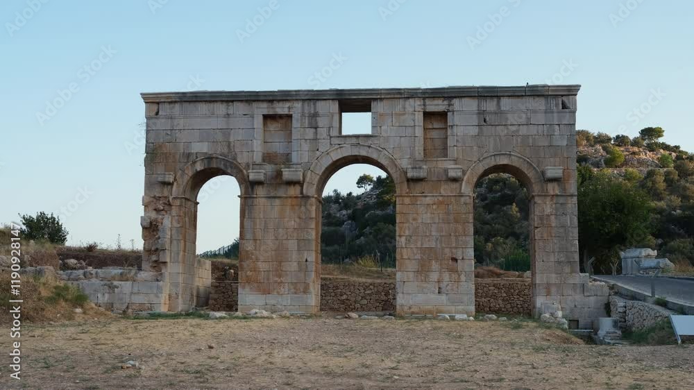 Ruins of the ancient Lycian harbour city of Patara. Modestus Triumphal Arch. Ancient city entrance gate. The city of Patara was the capital of the Lycian (Lycia) union. Antalya city, Turkey country Ruins of the ancient Lycian harbour city of Patara. Modestus Triumphal Arch. Ancient city entrance gate. The city of Patara was the capital of the Lycian (Lycia) union. Antalya city, Turkey country