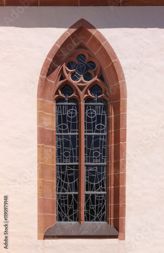 Pointed ogive window with gothic cinquefoil tracery at the church of Schaidt, city of Wörth am Rhein in Germany photo