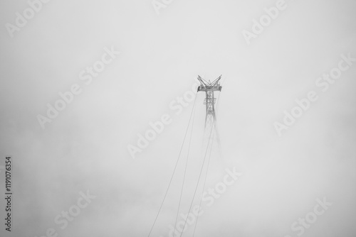 metal pole covered in fog
power line
green energy