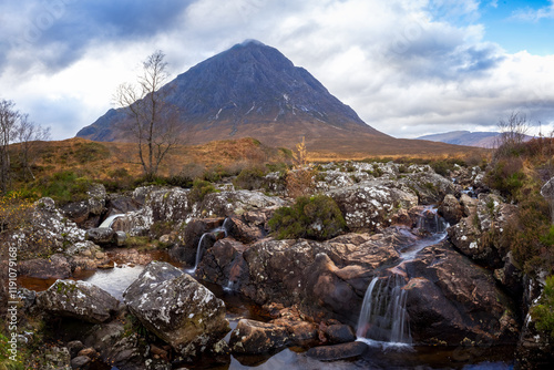 Rocks and waterfall at Buachaille Etive Mor at Glencoe in the highlands of Scotland photo