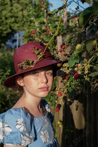 portrait of a girl with green eyes in a garden