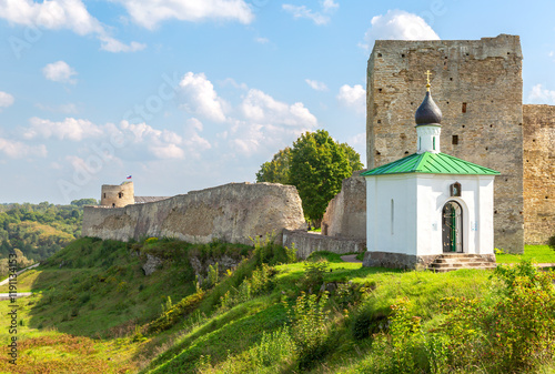 Orthodox Chapel of the Korsunskaya Icon of the Mother of God and Talav Tower of the medieval Izborsk fortress photo