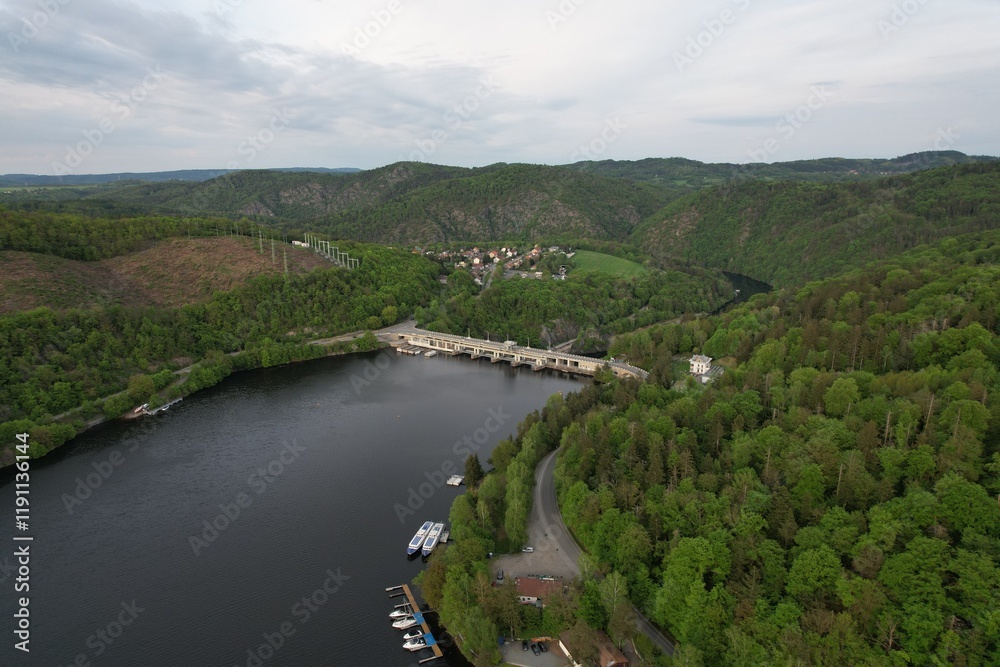 Obraz premium Slapy Reservoir is dam on the Vltava river in the Czech Republic, near to village Slapy. It has a hydroeletrics power station included.Aerial panorama landscape photo 