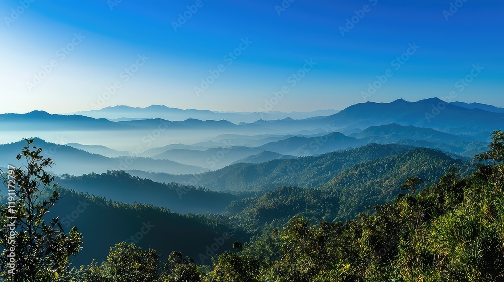 Serene Mountain Landscape at Dawn with Misty Valleys and Blue Sky Serene Mountain Landscape at Dawn with Misty Valleys and Blue Sky