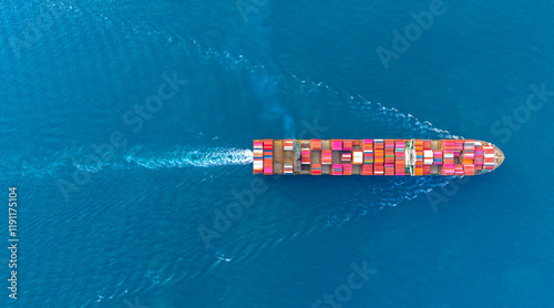 Top view Cargo Container ship with contrail in the ocean ship carrying container and running for import export concept technology freight shipping by ship.