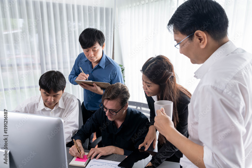Group of diverse office worker employee working together on strategic business marketing planning in corporate office room. Positive teamwork in business workplace concept. Prudent Group of diverse office worker employee working together on strategic business marketing planning in corporate office room. Positive teamwork in business workplace concept. Prudent
