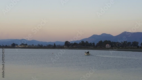 Nafplion port with fishermen boats at sunset in Greece photo