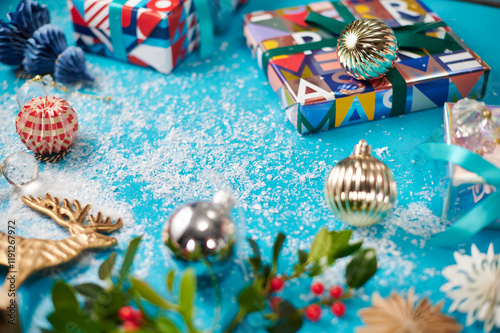 Modern Christmas decorations with wrapped presents, Christmas baubles and snow photo