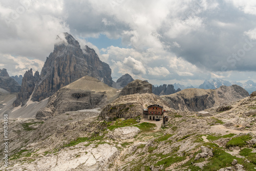 Awesome landscape, Italian Dolomites. a hiking trail from Büllelejochhütte, rifugio pian de cengia. Majestic landscape, Active summer vacation. Healhty lifestyle. Amazing nature. Hikers next to the hu photo