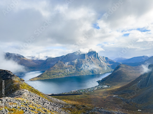 Stunning autumn landscape of Segla Mountain in Senja Island, Northern Norway, with dramatic cliffs and fjords.