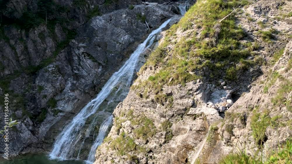 Large waterfall in the mountain, big waterfall in the alps Large waterfall in the mountain, big waterfall in the alps