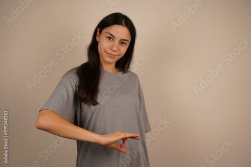 It is a gesture full of joy and positive energy. A woman makes an 