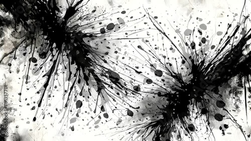 A monochromatic abstract design featuring black ink splatters on a textured gray background.