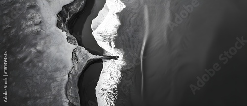 Aerial View of Beach Waves Meeting Black Sand Shoreline in Monochrome