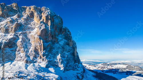 Forcella del Sassolungo, nestled in the Val Gardena ski resort, reveals its stunning winter beauty in this aerial drone capture. Located near the iconic Piz Sella