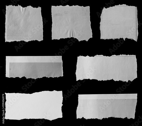 Torn papers on black