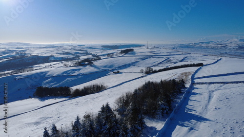 Snowy Winter Wonderland Over Elslack Moor and Pendle Hill, from Near Lothersdale, The Yorkshire Dales, North Yorkshire, England, UK photo