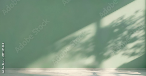 Minimalistic beautiful background, light green painted wall with blurred shadow from window with marble floor. Copy space