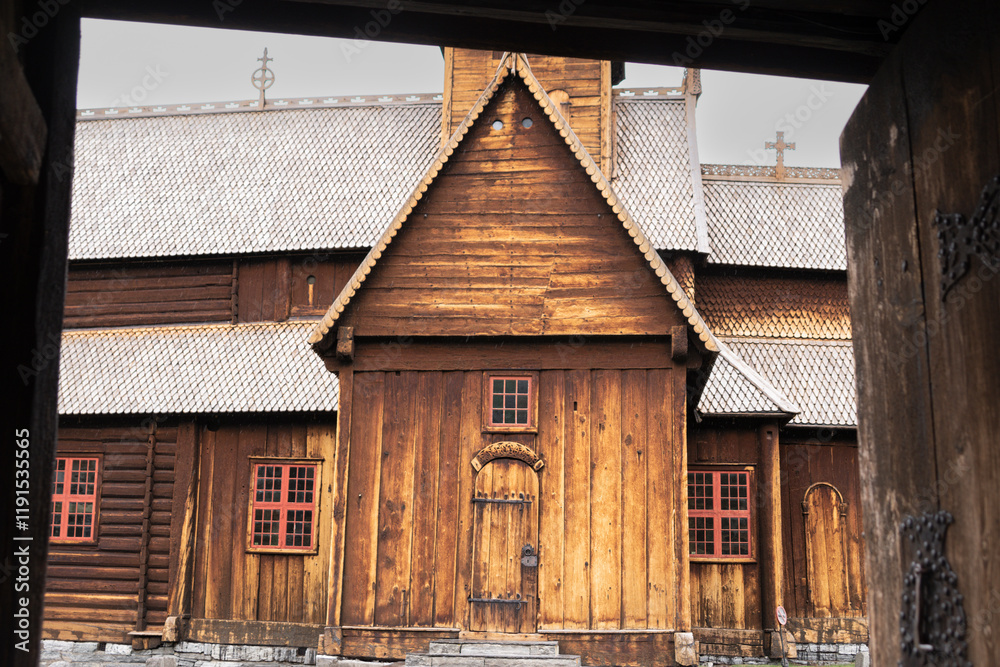 Fasade of Lom stave church (stavkirke) - famous wooden medieval landmark of Norway in Gudbrandsdal valley. Fasade of Lom stave church (stavkirke) - famous wooden medieval landmark of Norway in Gudbrandsdal valley.