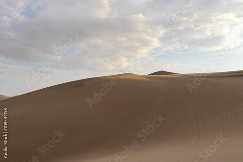 The sand dunes of Huacachina, Peru are a very popular tourist spot, where many try sandboarding or driving dune buggies.