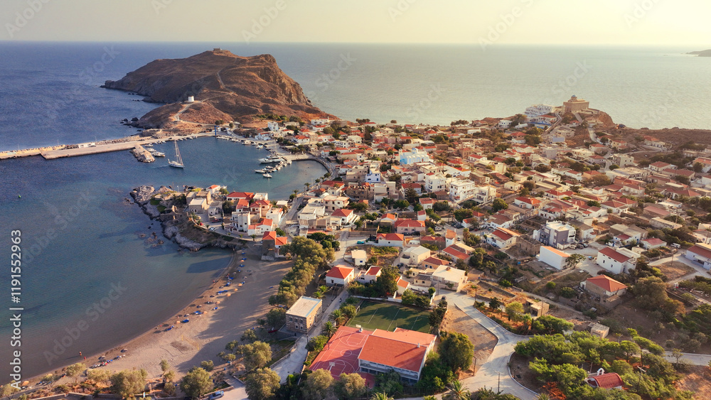 Fototapeta premium Aerial drone photo of picturesque and historic main village of Psara island featuring landmark church of Saint Nikolas, North Aegean islands, Greece