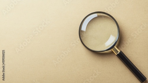 A magnifying glass lies on a neutral background, symbolizing the search for knowledge, solutions, or hidden details