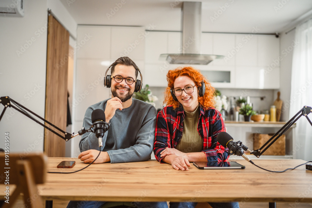 portrait of two radio hosts smile and enjoy while record podcast portrait of two radio hosts smile and enjoy while record podcast