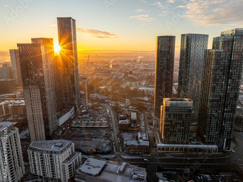 Fototapeta Naklejka Na Ścianę i Meble -  Beautiful sunrise over Deansgate Square high-rises in Manchester UK with cityscape covered with frost. 