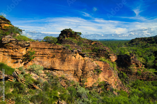 Spectacular layered red sandstone rocks in the remote wilderness of Mirima National park, close to Kununurra, eastern Kimberleys, in the north of Western Australia. 
 photo
