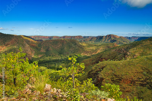 Savanna outback landscape with red hills at the valley of the Ord River, near the East Kimberley town of Kununurra, Western Australia
