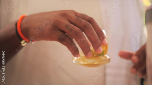 Man about to drink his rum drink/ti punch (Martinique)