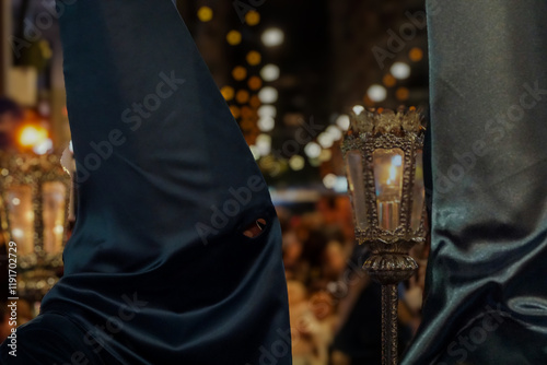Nazarenes of Friday of Sorrows, processioning through the streets of Murcia, on a cold night in March