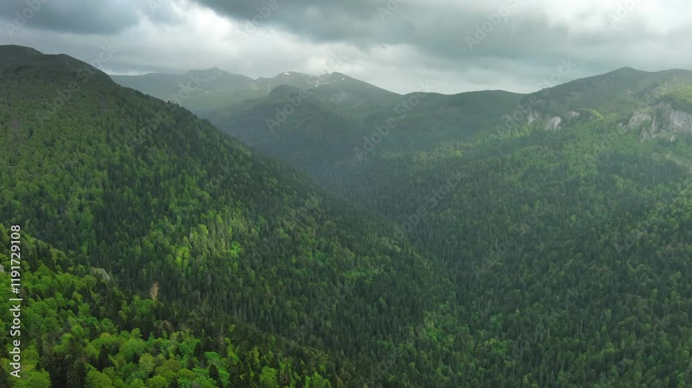 Aerial view of dark clouds over summer green mountains landscape, 4k Aerial view of dark clouds over summer green mountains landscape, 4k