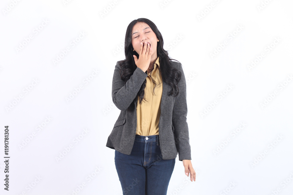 Woman in a gray blazer and jeans is yawning. Business asian woman Woman in a gray blazer and jeans is yawning. Business asian woman
