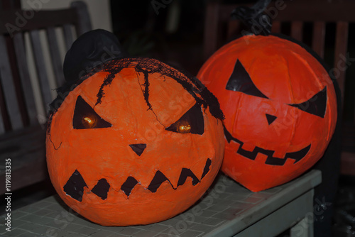Two orange pumpkin heads, handmade, Halloween night, Halloween celebration.
