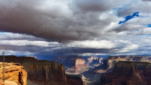 A time lapse of clouds moving over a desert canyon photo