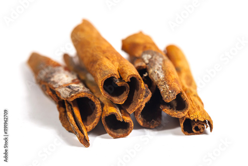 Fototapeta Naklejka Na Ścianę i Meble -  Cinnamon stick isolated on white background. Cinnamon bark is a spice obtained from the inner bark of several species of trees of the genus Cinnamomum that is used for sweet and savory dishes.