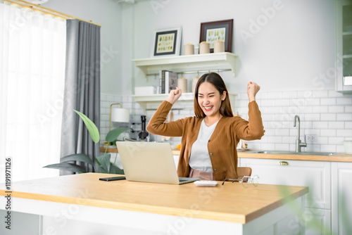 Wallpaper Mural Funny euphoric young asian woman celebrating winning or getting ecommerce shopping offer on computer laptop. Excited happy girl winner looking at notebook celebrating success Torontodigital.ca