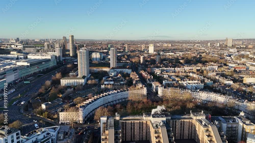 Crescent of houses Panning drone aerial to Westfield shopping centre Sheppards Bush London UK Crescent of houses Panning drone aerial to Westfield shopping centre Sheppards Bush London UK