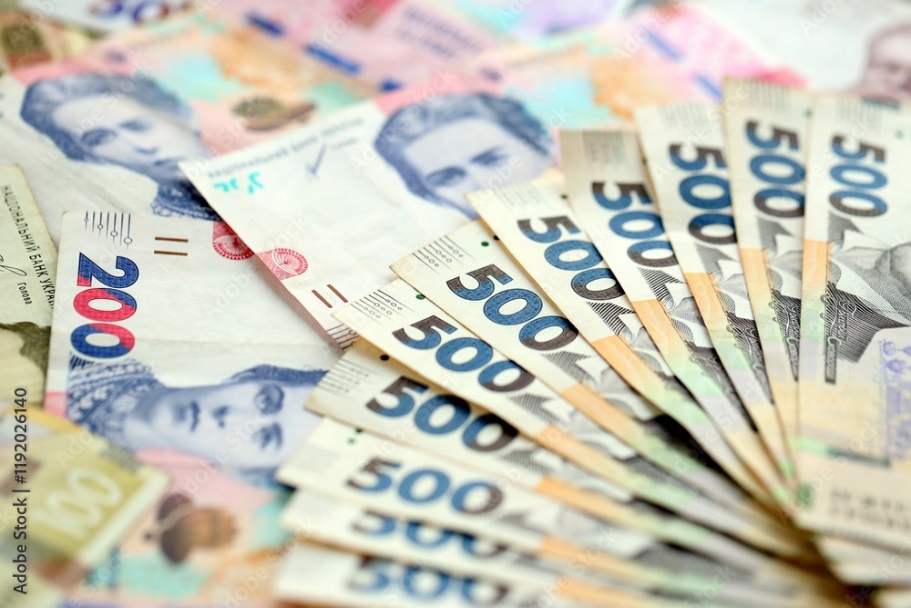Big amount of different ukrainian hryvnia currency money bills in pile Big amount of different ukrainian hryvnia currency money bills in pile