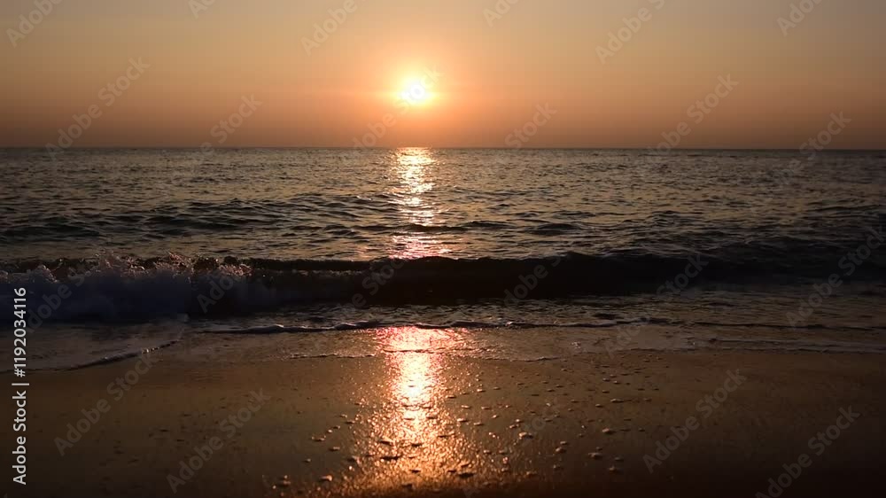 abstract washed-out sea with wave and foam, shoreline in the sunset light, glare and bokeh, sunset on the beach, Footsteps in the sand on the beach abstract washed-out sea with wave and foam, shoreline in the sunset light, glare and bokeh, sunset on the beach, Footsteps in the sand on the beach