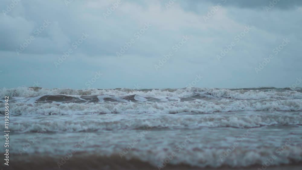Beautiful sea waves at Mandvi beach in Kutch, Gujarat, India. Ocean waves crashing on shore during stormy weather. Water texture. Travel and holidays background. Beautiful sea waves at Mandvi beach in Kutch, Gujarat, India. Ocean waves crashing on shore during stormy weather. Water texture. Travel and holidays background.