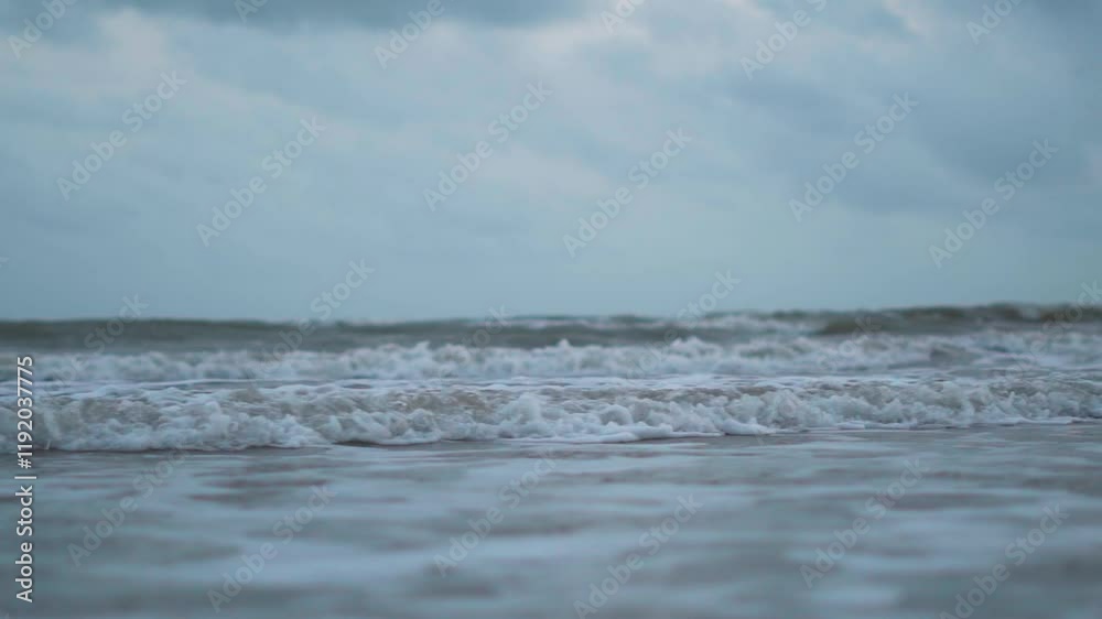 Close up shot of frothy sea waves crashing on sandy beach at Mandvi, Kutch, India. Slow motion video of waves water. Tropical beach close up slow motion video Close up shot of frothy sea waves crashing on sandy beach at Mandvi, Kutch, India. Slow motion video of waves water. Tropical beach close up slow motion video